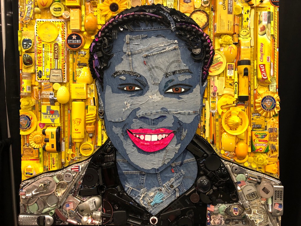 A photo of a mosaic of an African-American woman surrounded by yellow objects that represent her background.
